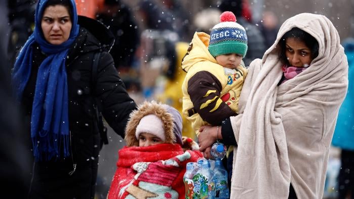 People fleeing the Russian invasion of Ukraine arrive at a temporary camp in Przemysl, Poland, February 28, 2022.