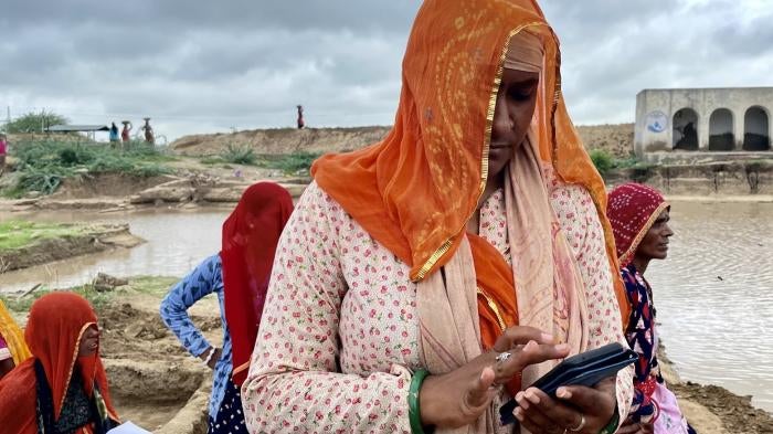 A woman using a phone outside