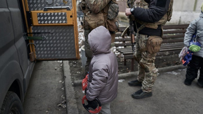 Civilians, including two young children, are evacuated from a shelling zone, Pokrovsk, Ukraine, February 14, 2025.