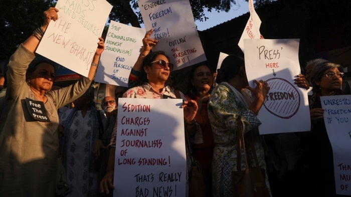 Members of the media protest a police raid on the office of a news portal and homes of journalists and writers linked to it, at the Press Club in New Delhi, India, October 4, 2023.
