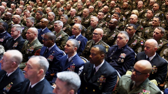 Members of the military attend a meeting convened by US Defense Secretary Pete Hegseth, at Marine Corps Base Quantico, in Quantico, Virginia, September 30, 2025.