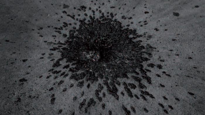 A crater and fragmentation marks consistent with a cluster muntion strike remain five days after an August 12, 2008, attack on the main square of Gori, Georgia. Russia struck the square with an Iskander cluster munition missile, killing six civilians and 