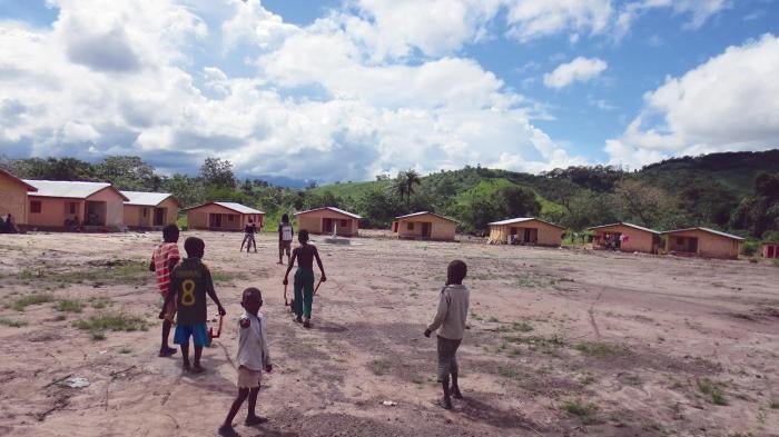 Children play in one of the new villages created on arid plots of land to house families who were relocated to make room for the African Minerals Limited iron ore mine near the town of Bumbuna, Sierra Leone.