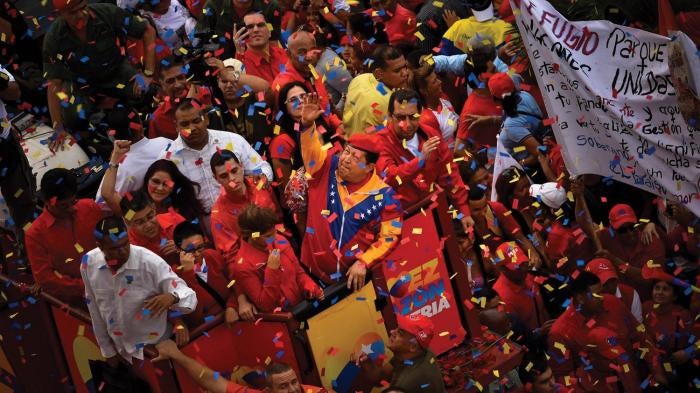 President Hugo Chávez waves to supporters on the day he registered for re-election in Caracas, Venezuela, on June 11, 2012.