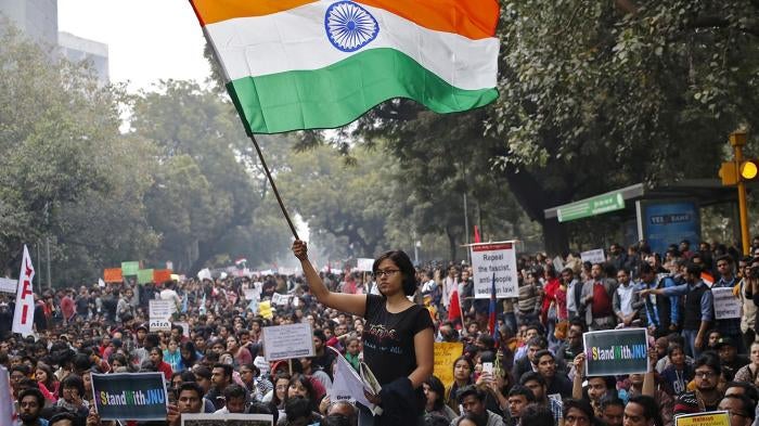 A demonstrator waves the Indian national flag during a protest on February 18, 2016, in New Delhi, India, demanding the release of Kanhaiya Kumar, a student union leader accused of sedition. In 2016 there has been a spike in the number of sedition cases f