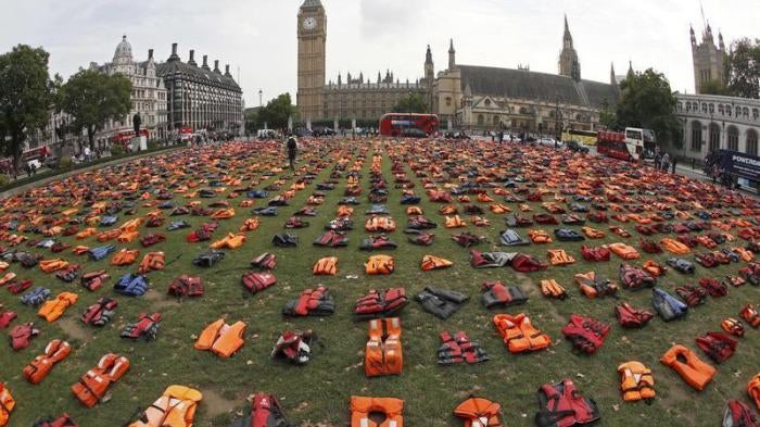 A display of lifejackets worn by refugees during their crossing from Turkey to the Greek island of Chois, are seen Parliament Square in central London, Britain September 19, 2016.