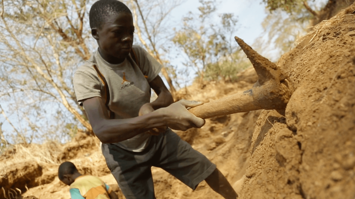 A picture of a child working in a gold mine.