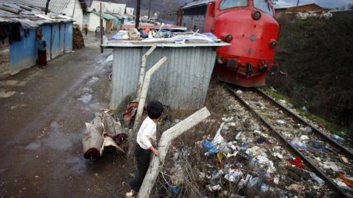 Roma children play in the Cesmin Lug refugee camp in Mitrovica city, northern Kosovo. Cesmin Lug is one of several camps that the UN established in what was known to be a heavily contaminated area near a defunct lead mine. December 12, 2007. 