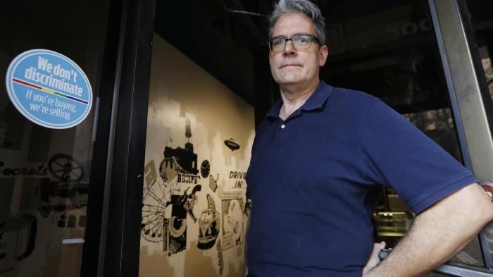 In response to the state’s “license to discriminate” bill, Steve Long displays a sticker welcoming LGBT customers to his restaurant in Jackson, MS, on October 2, 2017. 