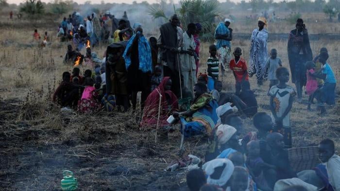People wait to be registered prior to a food distribution carried out by the United Nations World Food Programme (WFP) in Thonyor, Leer state, South Sudan, February 25, 2017.