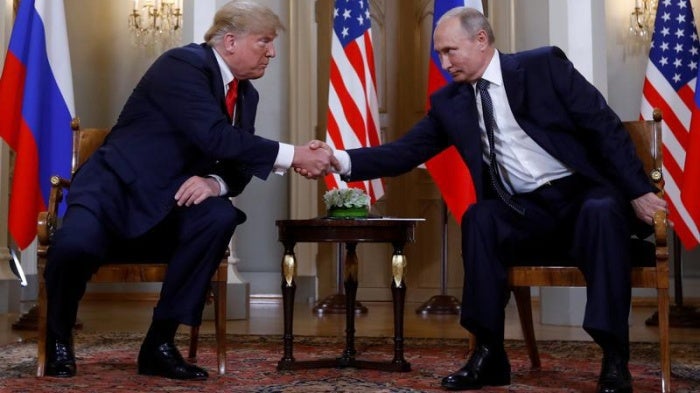 U.S. President Donald Trump and Russia's President Vladimir Putin shake hands as they meet in Helsinki, Finland July 16, 2018. 