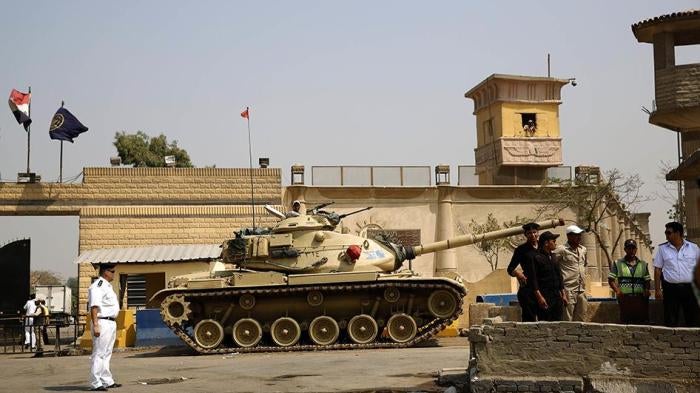 Egyptian security forces have been involved in systematic abuses such as enforced disappearance and torture and have used abusive counterterrorism laws and measures to crush peaceful dissent. Egyptian security forces stand guard outside one of the entranc