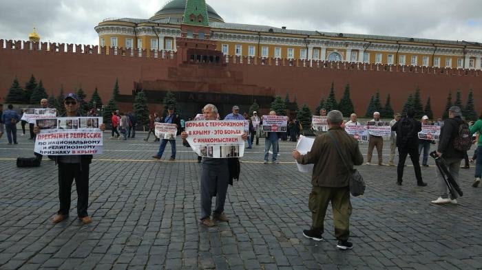 Crimean Tatar activists protest politically motivated arrests of terrorism charges in Moscow’s Red Square on July 10, 2019.