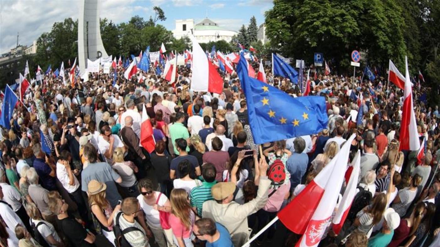 Protesters gather in front of the Parliament building during an opposition protest in Warsaw, Poland, July 16, 2017