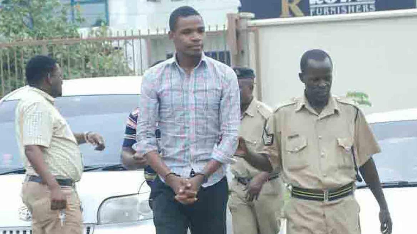 Prison guards escort Bob Chacha Wangwe to the Kisutu Magistrates Court in Dar es Salaam, May 11, 2016.