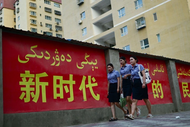 A propaganda slogan promoting ethnic unity in "the new era," in both Chinese and Uyghur languages, in Yarkant, northwestern China's Xinjiang region, July 18, 2023.