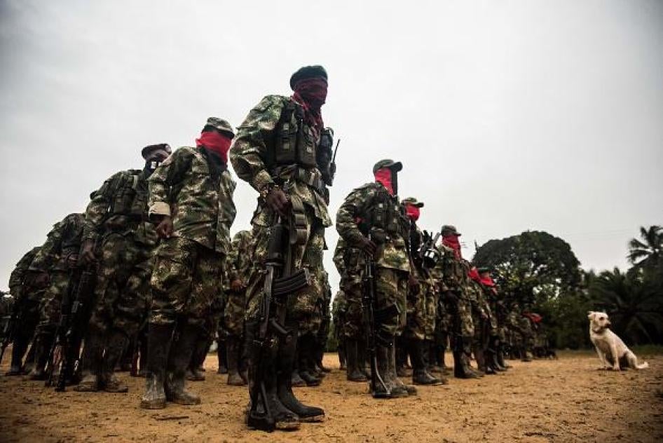 National Liberation Army (ELN) guerrilla members line up in their camp on the banks of the San Juan River, Chocó state, Colombia, on November 21, 2017. 
