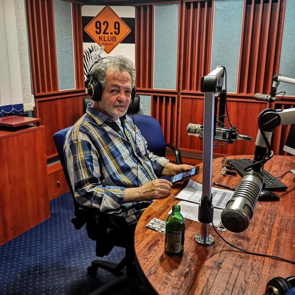 Klubradio’s president, Andras Arato, is seen on air in Klubradio's studio in Budapest, Hungary, March 2020. 
