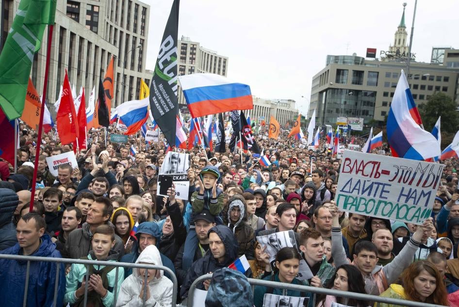 Tens of thousands of people rallied in central Moscow Russia, Saturday, Aug. 10, 2019, for the third consecutive weekend to protest the exclusion of opposition and independent candidates from the Russian capital's city council ballot.