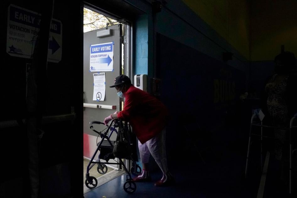 A woman departs the Beethoven Elementary School after participating in early voting in Chicago, October 15, 2020. 