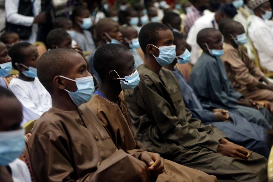 Freed schoolboys look on during a meeting with Nigeria's President Muhammadu Buhari, December 18, 2020, in Katsina, Nigeria, days after an armed group attacked their school and kidnapped them.