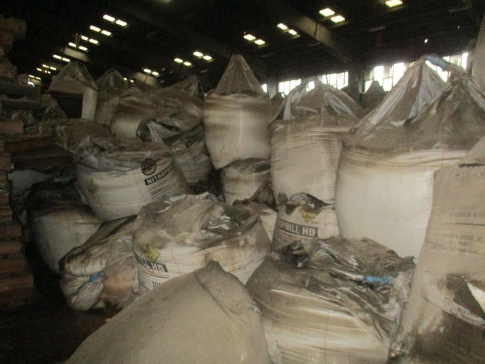 stacks of bags labeled ammonium nitrate