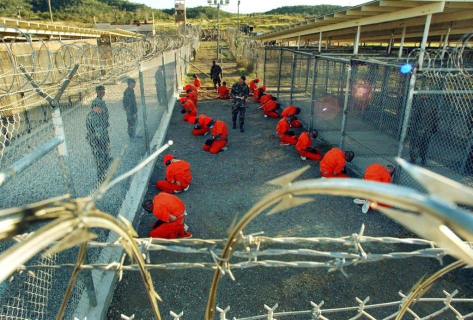 Detainees apprehended after September 11, 2001 in a holding area under surveillance of the US military at Camp X-Ray at the Guantanamo Bay Naval Base, Cuba on January 11, 2002. 