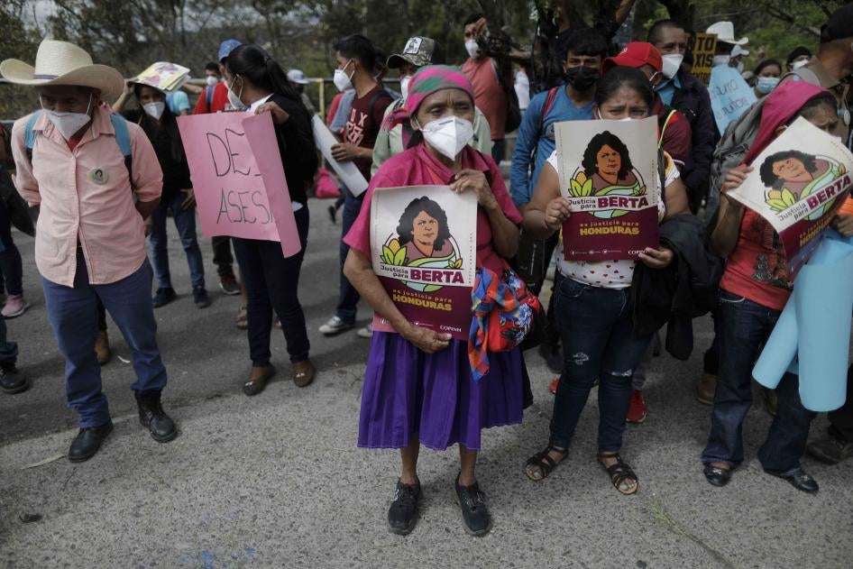 Supporters of Honduran environmental and Indigenous rights activist, Berta Cáceres, hold signs with her name and likeness during the trial of Roberto David Castillo, who was charged with her murder, outside of the Supreme Court building in Tegucigalpa, Honduras, on April 6, 2021. The trial began five years after the prize-winning activist's murder.