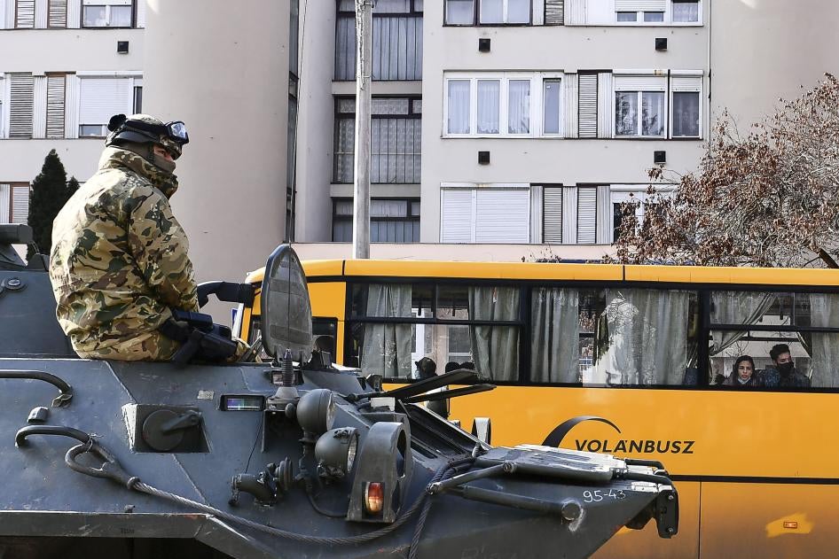 A troop rides in an armored personnel carrier