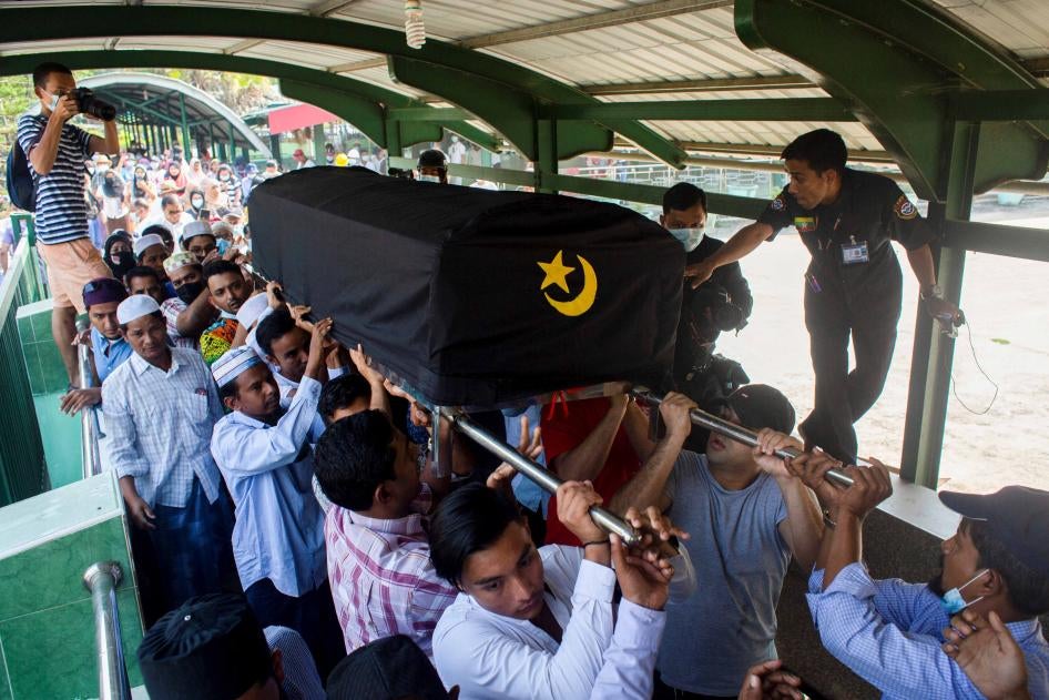 People attend the funeral of Khin Maung Latt