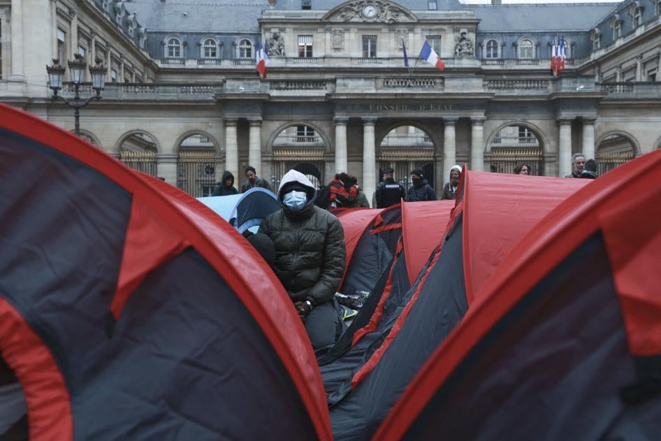 More than 200 young refugees demonstrate in front of the State Council building in Paris, December 2, 2022.  Many have been sleeping, some for 6 months or longer, under the bridges in Ivry-sur-Seine, on the outskirts of Paris.