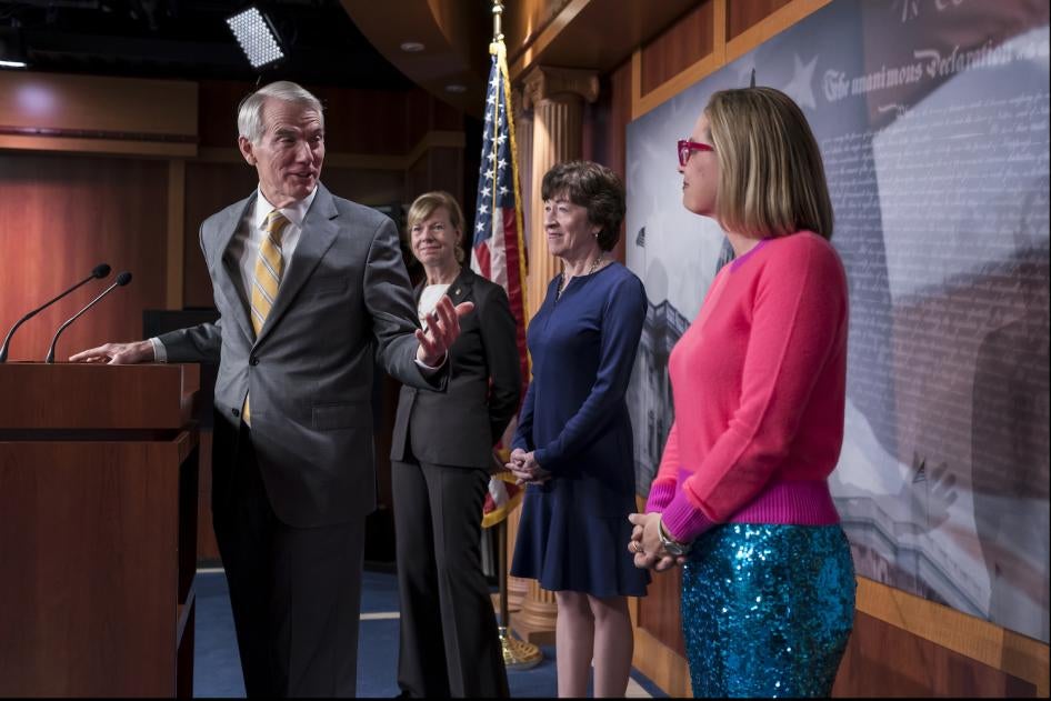 Senators talk with reporters following Senate passage of Respect for Marriage Act. 