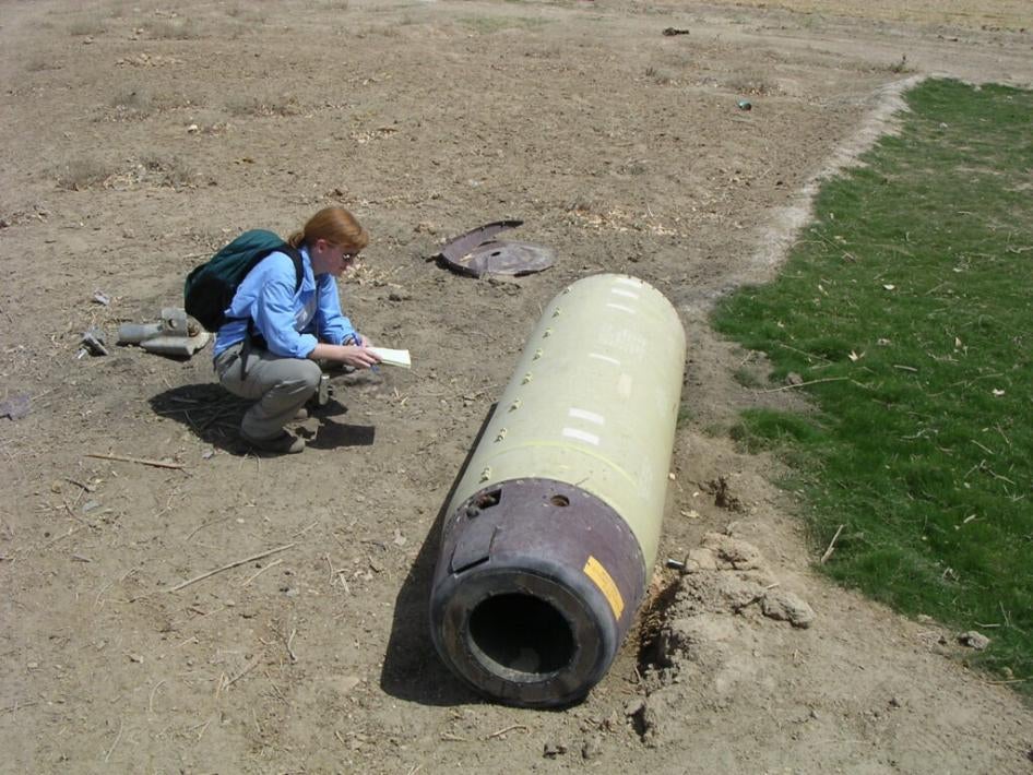 Bonnie Docherty examining a US ATACMS cluster munition outside of al-Hilla dropped on Iraq in May 2003.