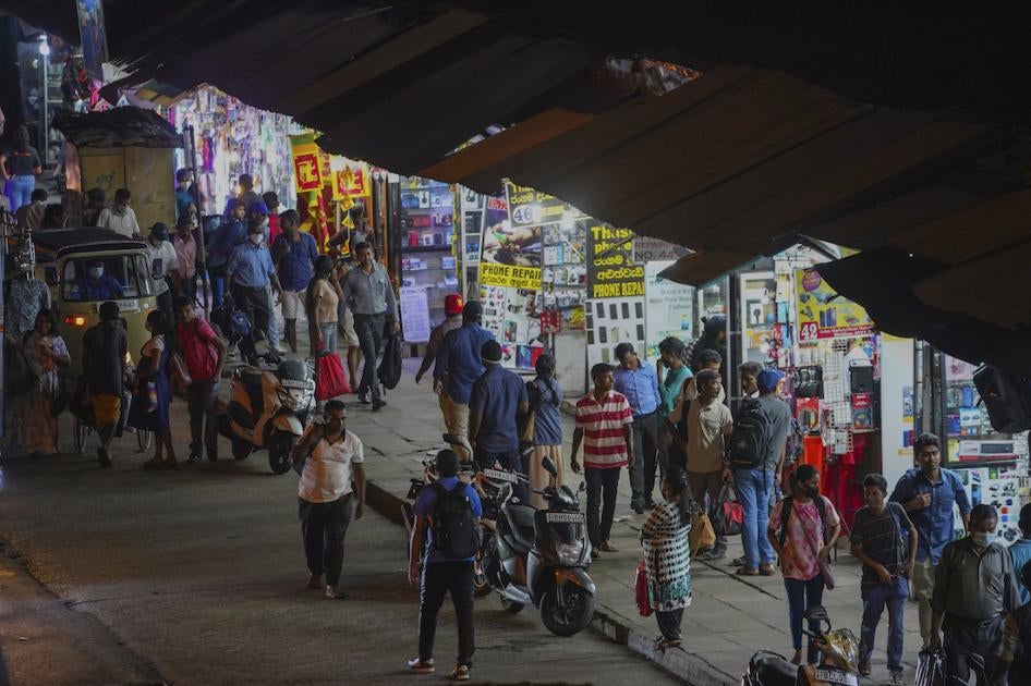 People walk on Pettah Street in Colombo, Sri Lanka, on February 3, 2023.