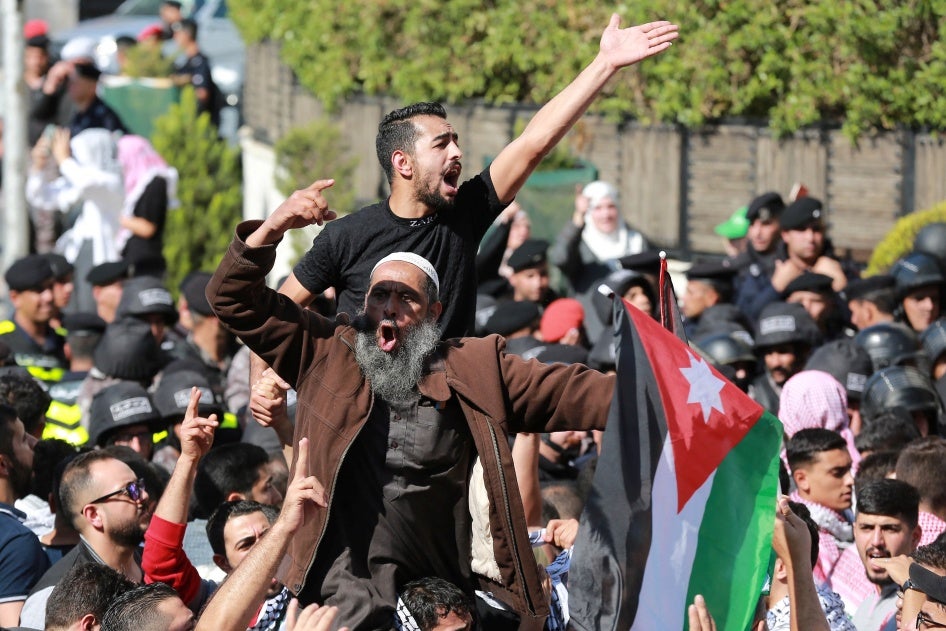 People protest near the Israeli Embassy in Amman on October 18, 2023, as they demonstrate against the killing of hundreds of Palestinians following a strike on a hospital in the Gaza Strip.