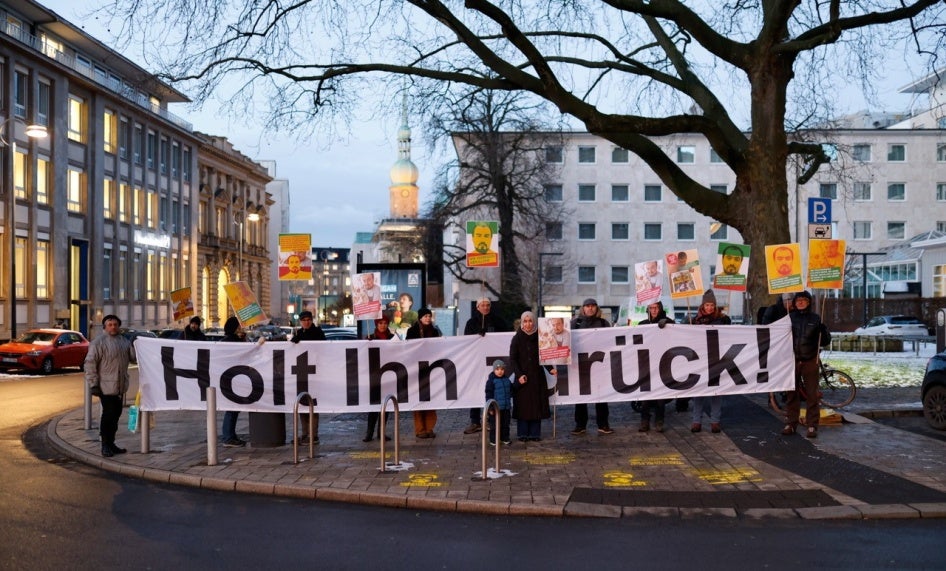A vigil on 18 January 2024 in Dortmund, Germany, on the anniversary of the deportation of Tajikistan opposition activist Abdullohi Shamsiddin. The banner reads: ‘Bring Him Back!’