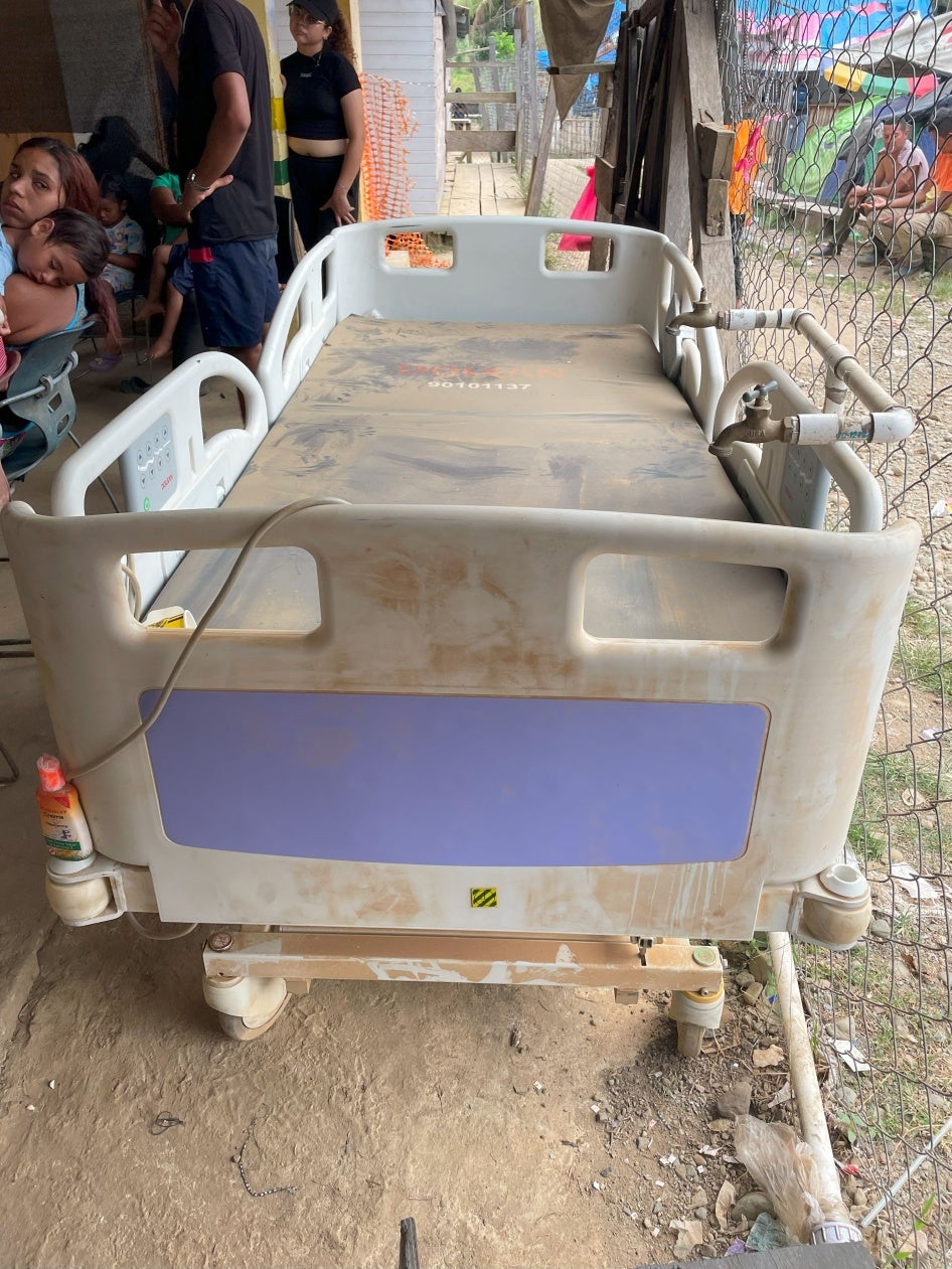 A dust-covered hospital bed