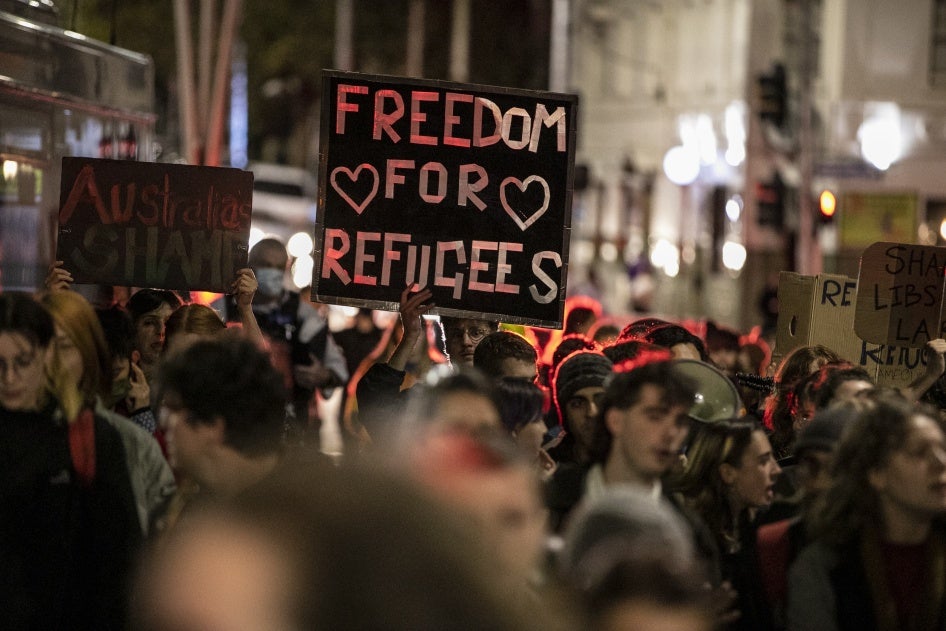 Demonstrators march on behalf of refugees and asylum seekers in Melbourne, Australia, April 19, 2021.