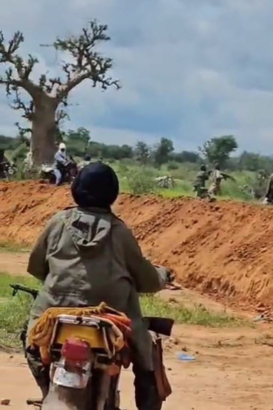 Screenshot of a video seemingly filmed by the JNIM showing fighters along the trench during the attack on Barsalogho,  Sanmatenga province,  Burkina Faso, on August 24, 2024.  