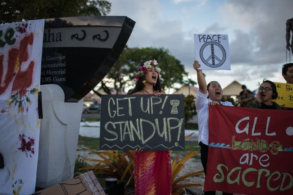 Members of community groups calling for the "de-colonization and de-militarization of Guam" attend a "People for Peace" rally in Hagatna on August 14, 2017.
