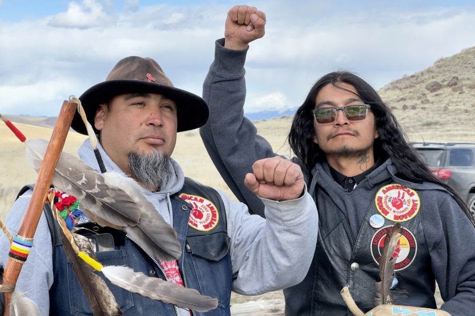 Two men raising their fists