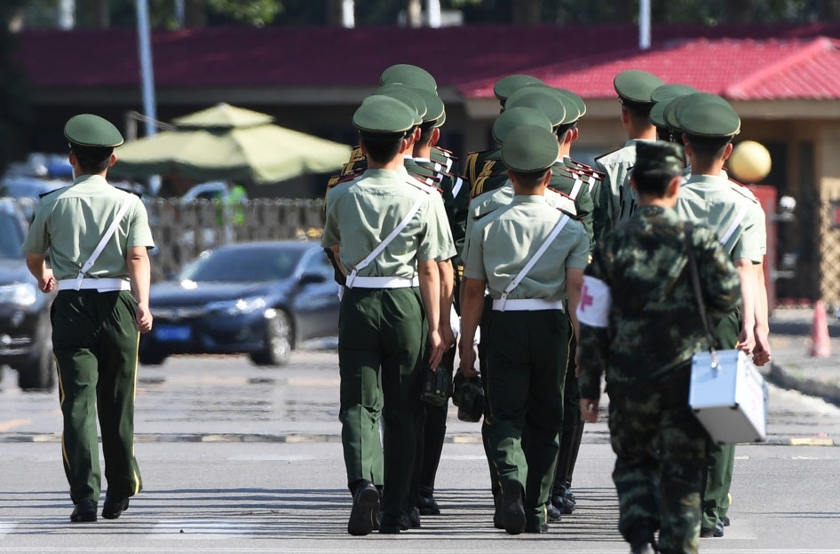 Chinese paramilitary police at the Beijing airport prepare for the departure of North Korean leader Kim Jong Un on June 20, 2018.