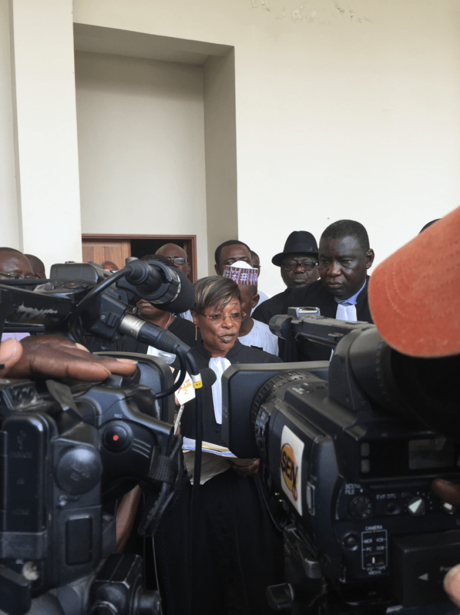 Jacqueline Moudeina speaking to reporters after the reading of the charges