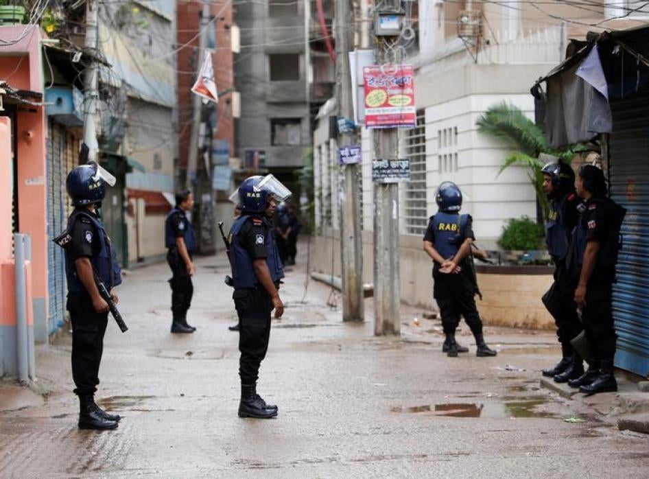 Security personnel block a road during a police operation in Dhaka, Bangladesh on July 26, 2016.