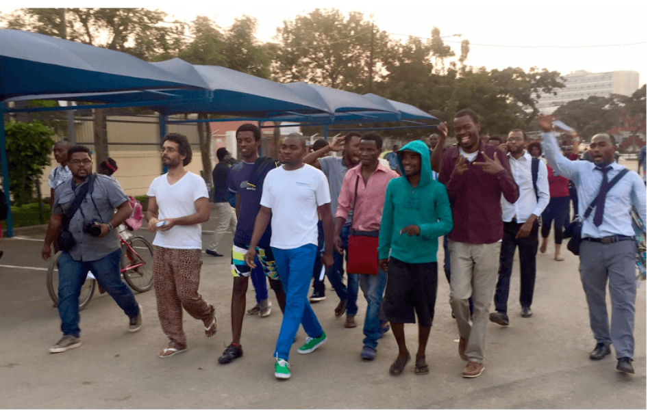 Book-club activists walk through the streets of Luanda after their provisional release.