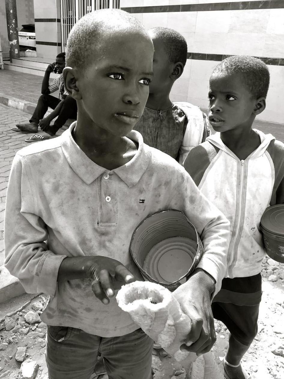 Talibés begging outside a pharmacy in Dakar, Senegal, May 7, 2017. 