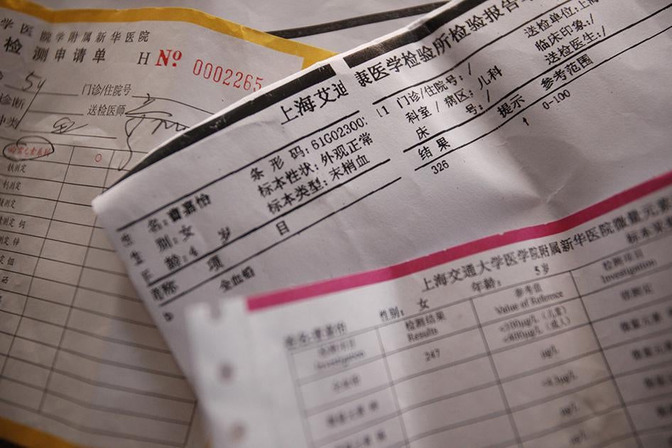 Test reports of lead levels of families in Kanghua New Village are shown Thursday, Sept. 15, 2011 in Shanghai, China.