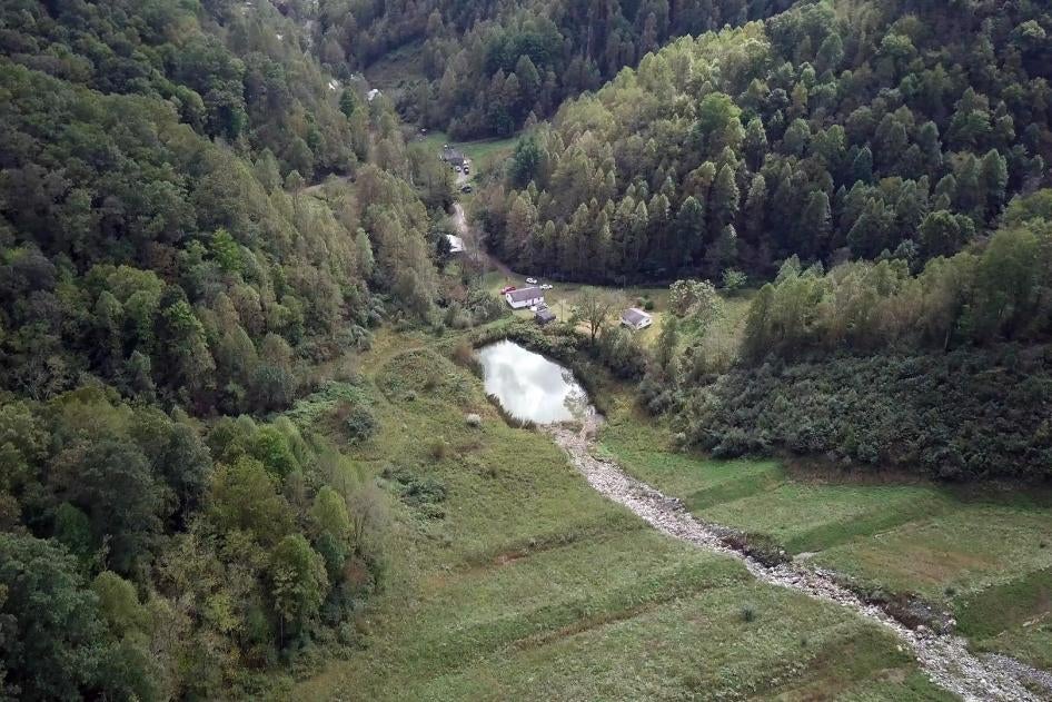 One of the mine’s valley fills. The rocks replace a buried stream and water collects in a sediment pond below, feeding into a stream that runs alongside a row of homes, all of which rely on private wells.
