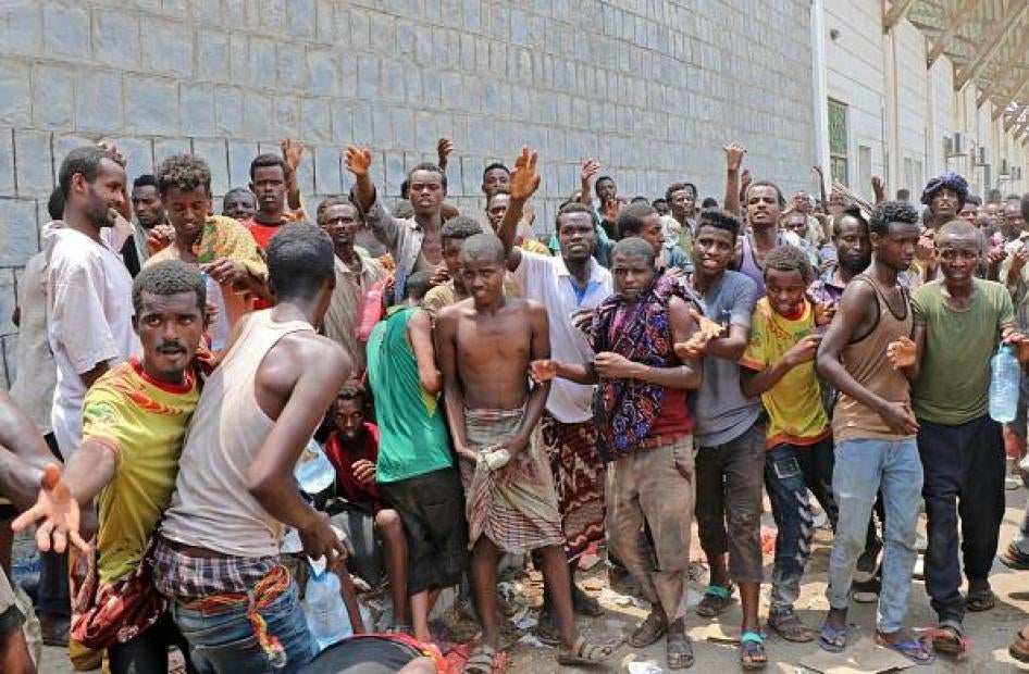 African migrants receive food and water inside a football stadium in the Red Sea port city of Aden in Yemen, on April 23, 2019. © AFP/Getty Images