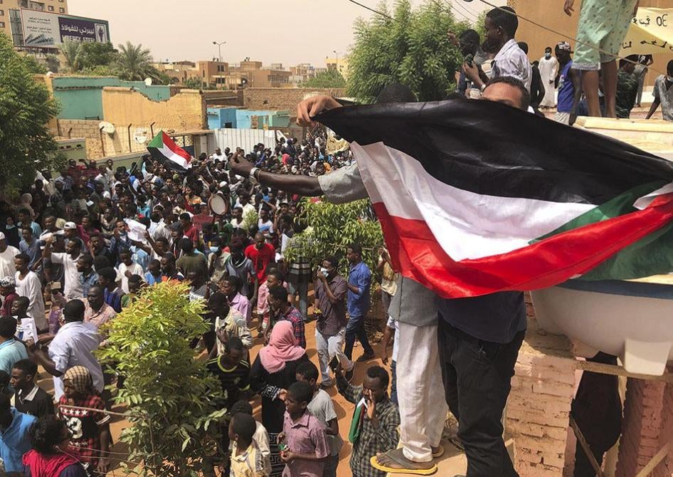 Sudanese protesters gather outside the house of a man killed by security forces on June 3, during a demonstration against the ruling military council.